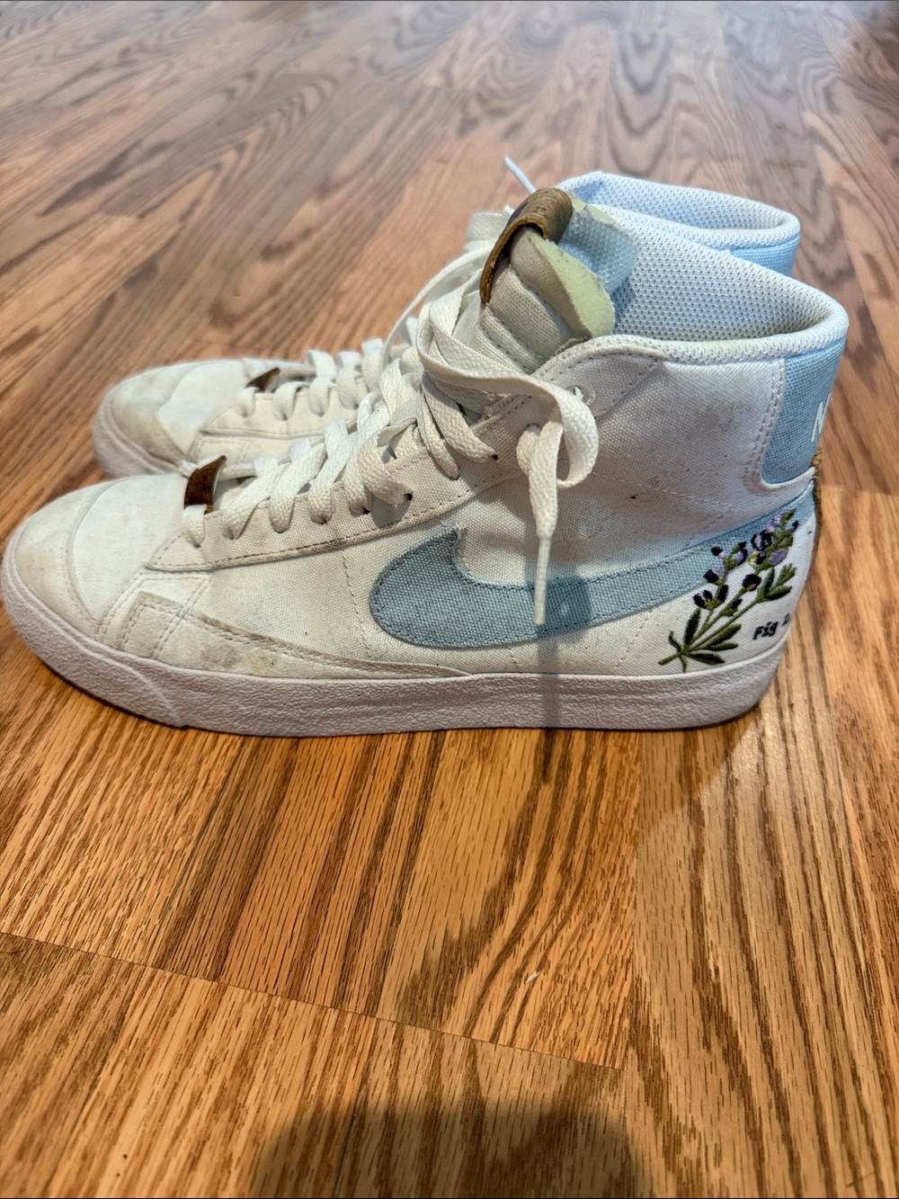 Nike White High-Top Sneakers with Cork Tongue Patch and Navy Logo
